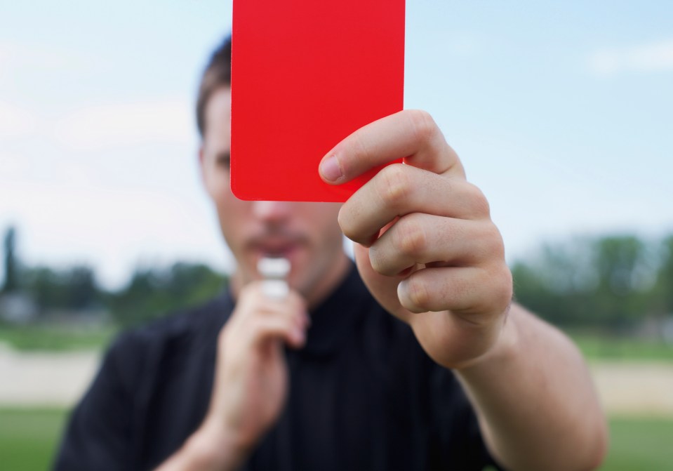 Referee showing a red card.