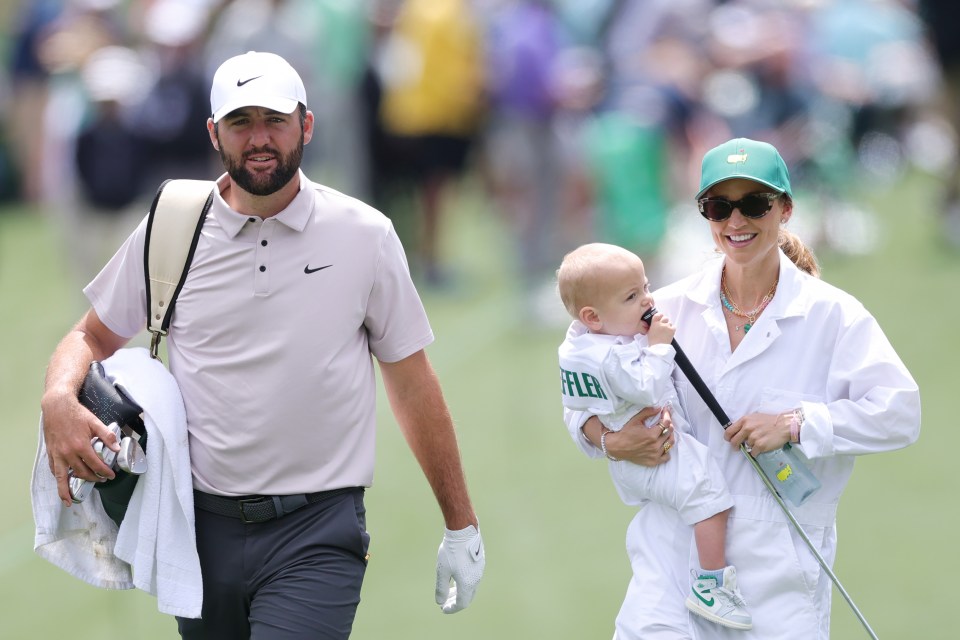 Scottie Scheffler walking with his wife and son.