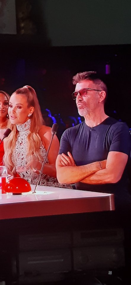 Simon Cowell on Britain's Got Talent, looking displeased.