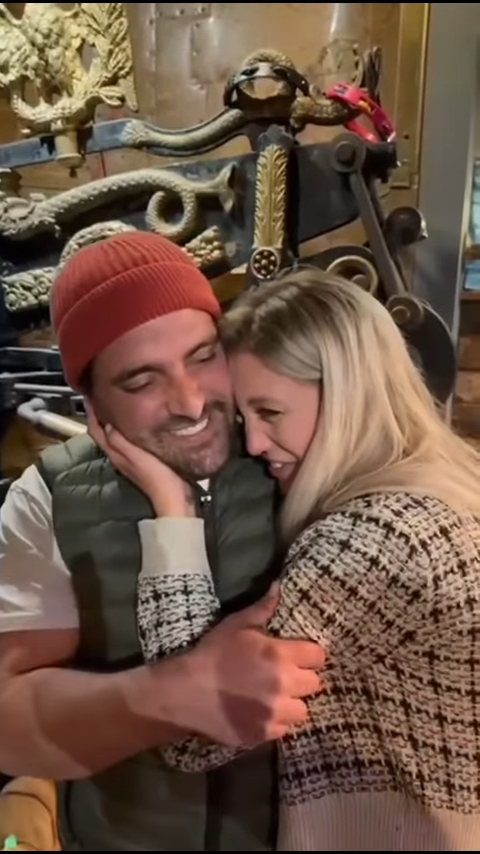 A man and woman embracing.