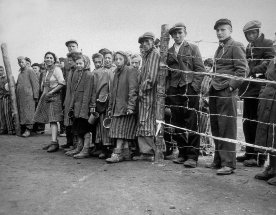 Starving internees at Belsen concentration camp awaiting potato soup rations.