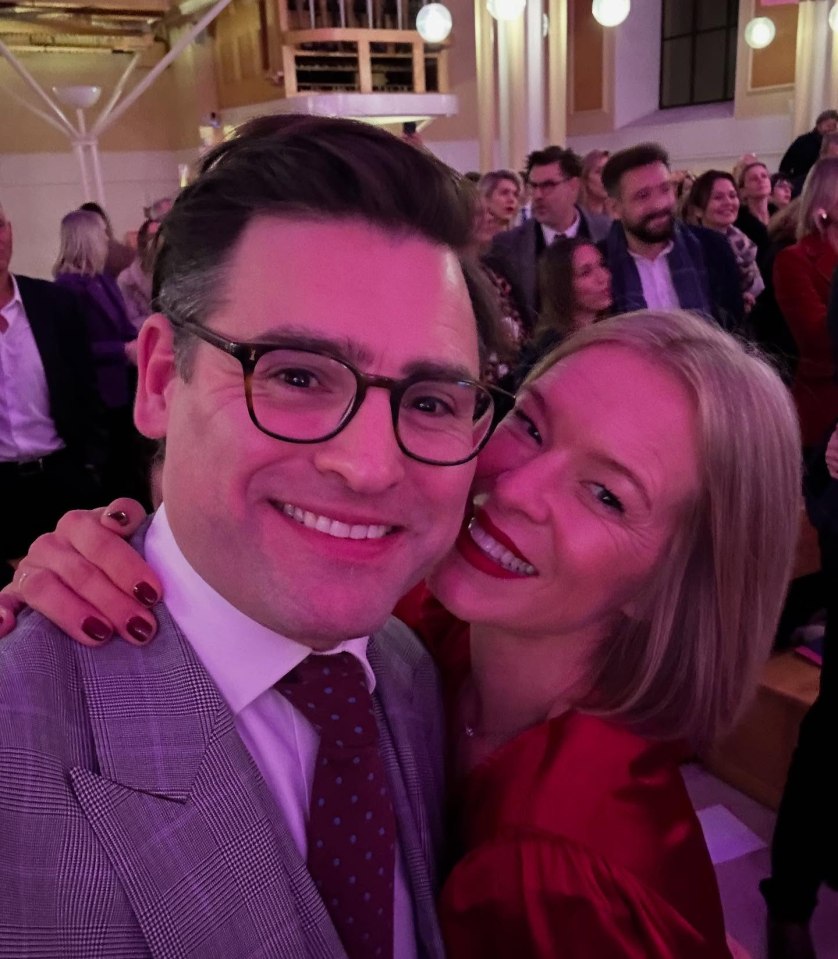 A man and woman posing for a selfie.