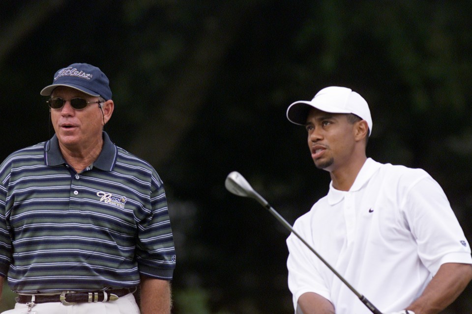 Tiger Woods practicing with his coach, Butch Harmon.