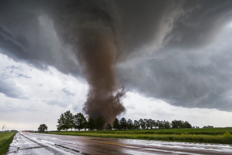 Tornado approaching a highway.