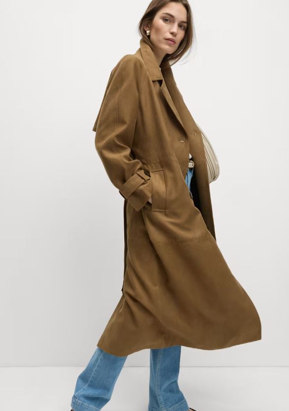 Woman wearing a brown trench coat.