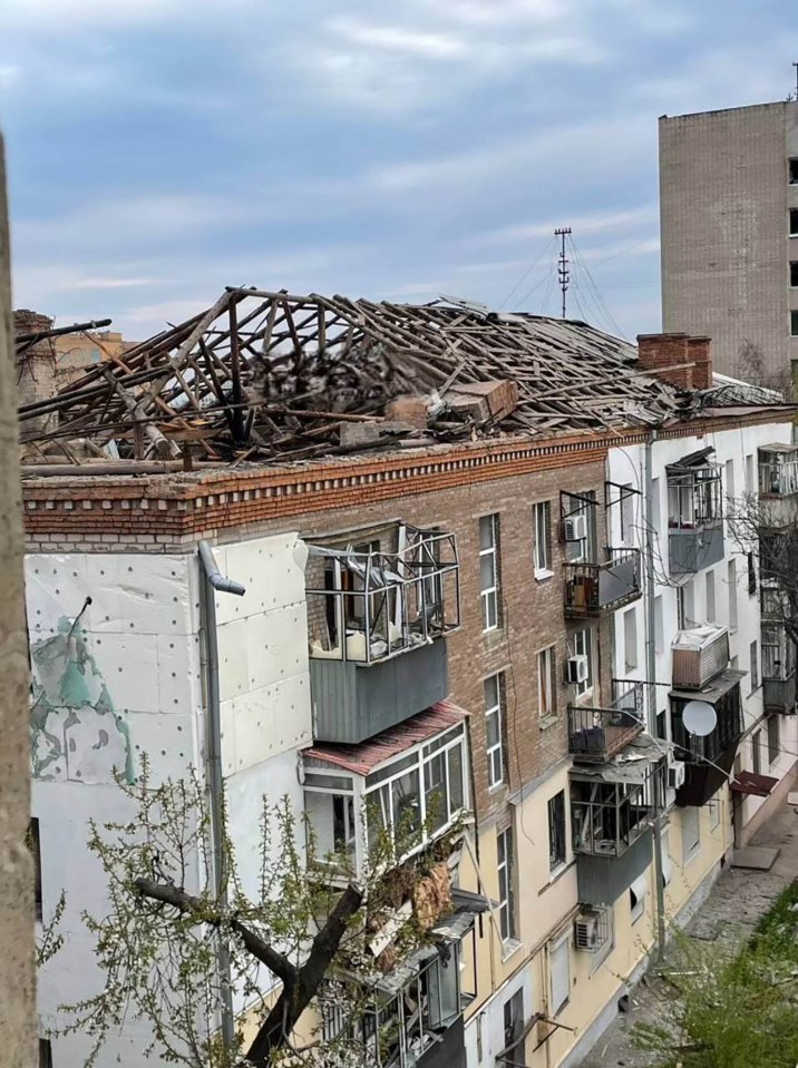Damaged apartment building after attack.