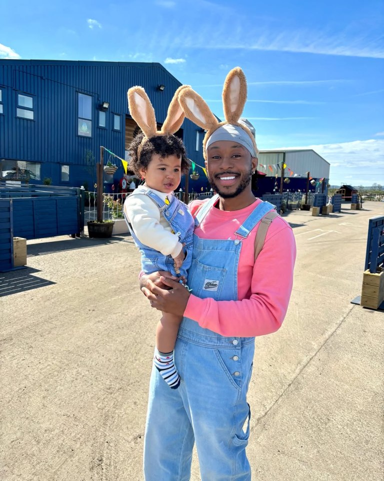 A man and a toddler wearing bunny ears.