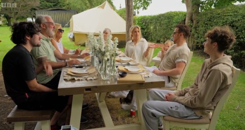Joe Swash and Stacey Solomon's family at an outdoor anniversary dinner.