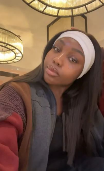 Whitney Adebayo in a white headband.