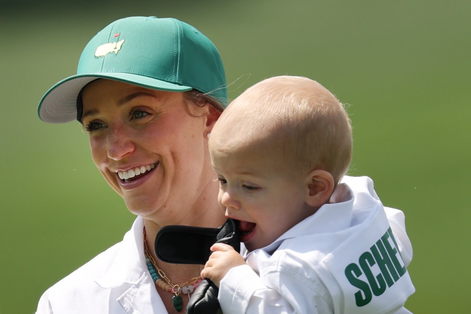 Meredith Scheffler holding her son, Bennett, at the Par Three Contest.