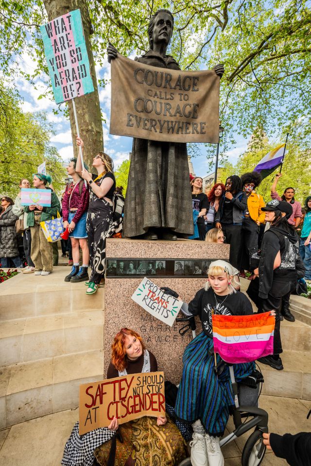 Protestors at the Millicent Fawcett statue in Parliament Square advocating for trans rights.
