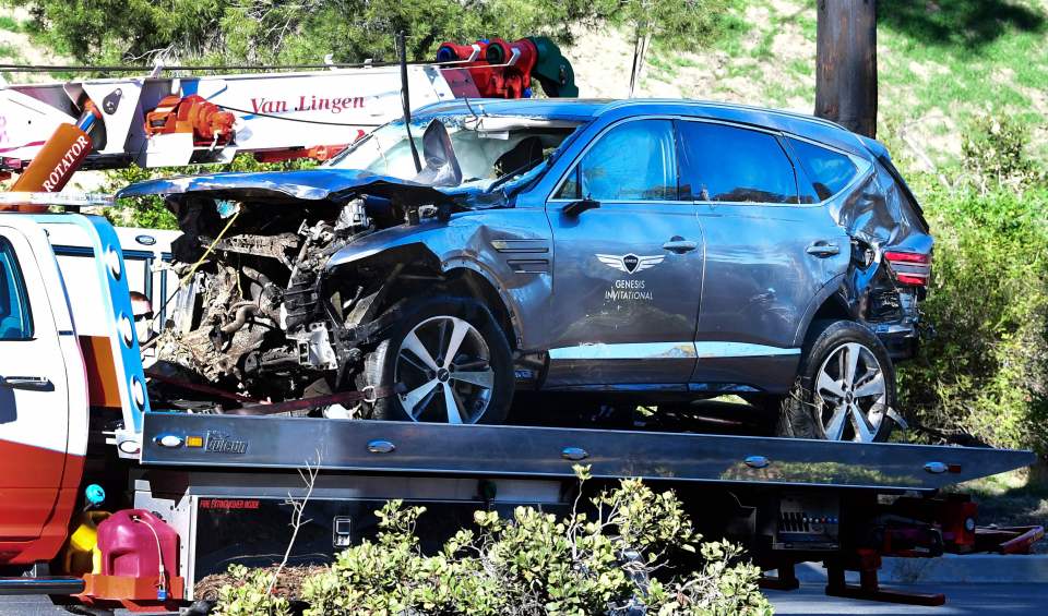 Damaged car on a tow truck after a rollover accident.