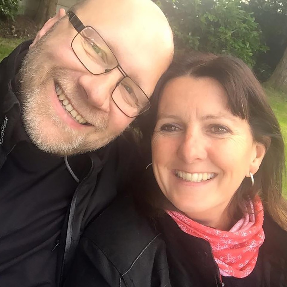 Photo of a smiling man and woman.