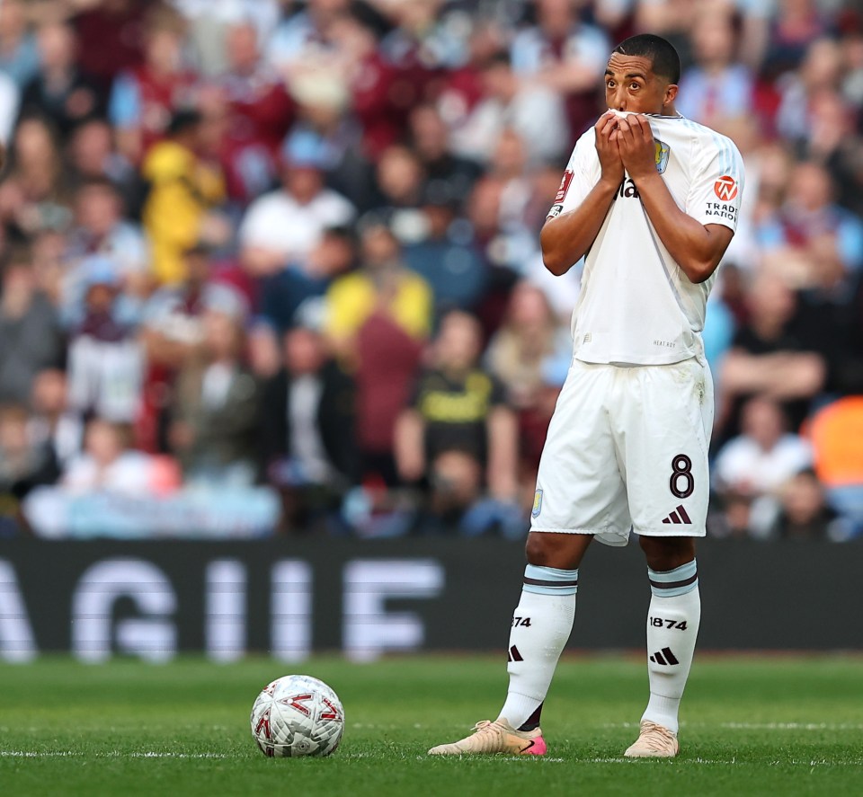 Youri Tielemans of Aston Villa looking dejected on the soccer field.
