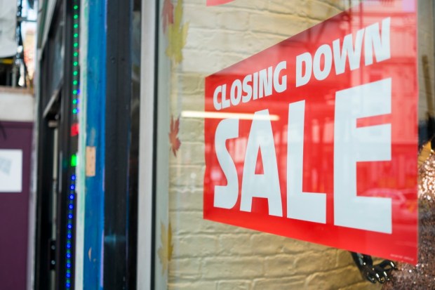 Closing down sale sign in a store window.
