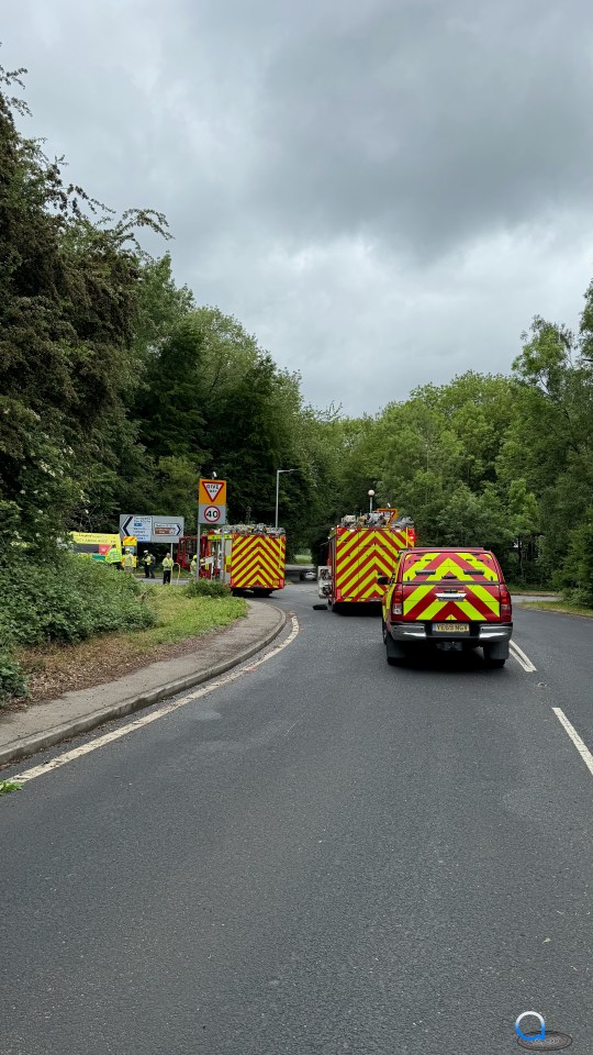 Emergency vehicles at the scene of a road accident.