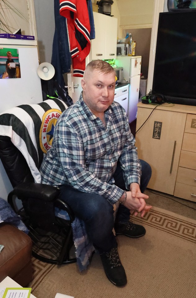 Man sitting on couch, giant rats stole his pizza.