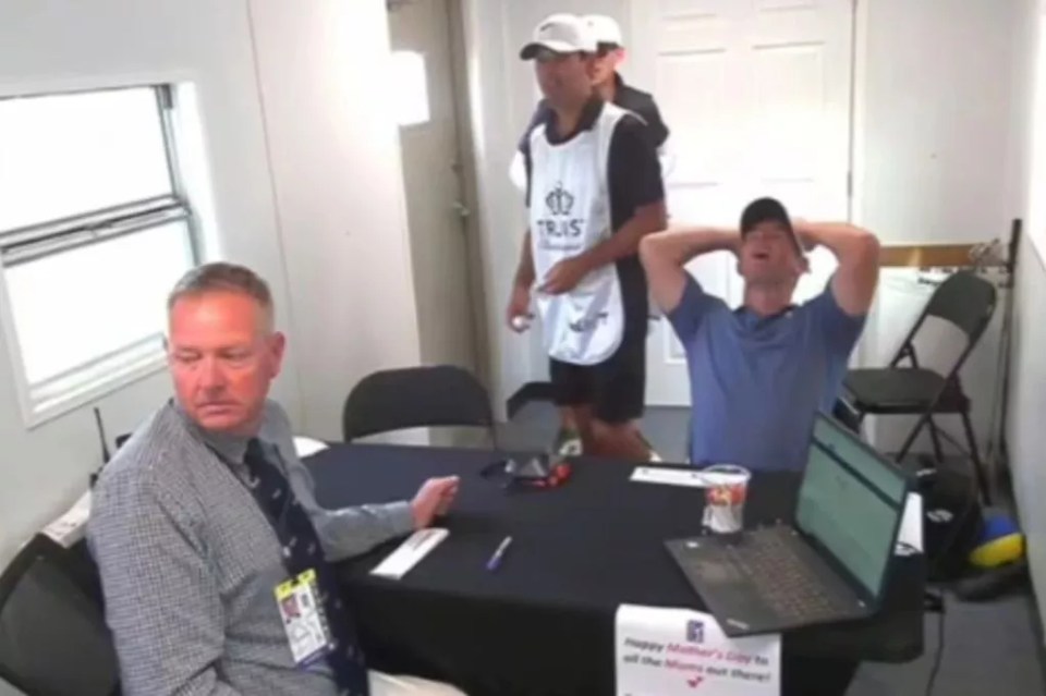 Rory McIlroy and his team in a room.