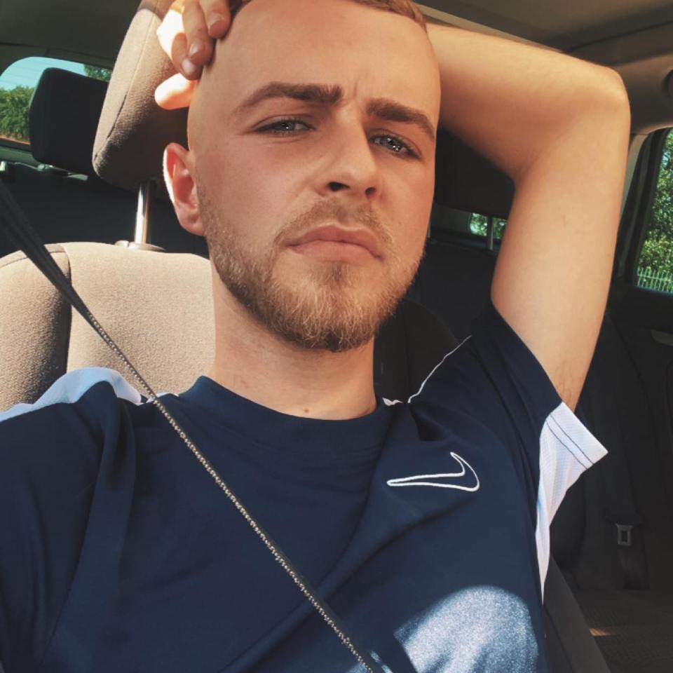 Self-portrait of a young man in a car.