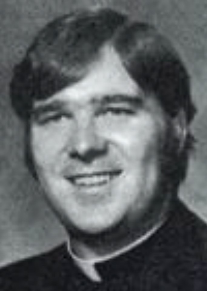 Black and white photo of Father James M. Ray.