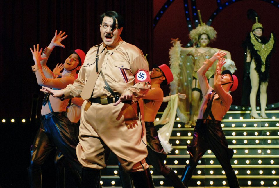 A publicity photo of Itzik Cohen as Adolf Hitler dancing in a production of "The Producers" in Tel Aviv.