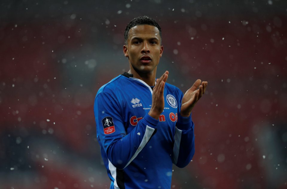 Soccer player Joe Thompson applauding.