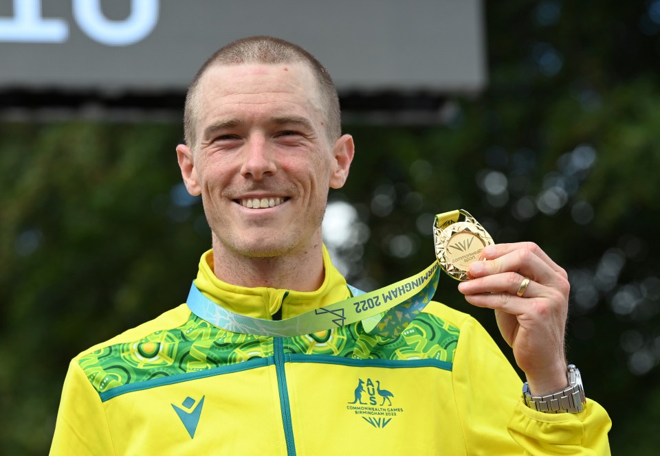 Rohan Dennis, Australian cyclist, holding his gold medal at the Commonwealth Games.