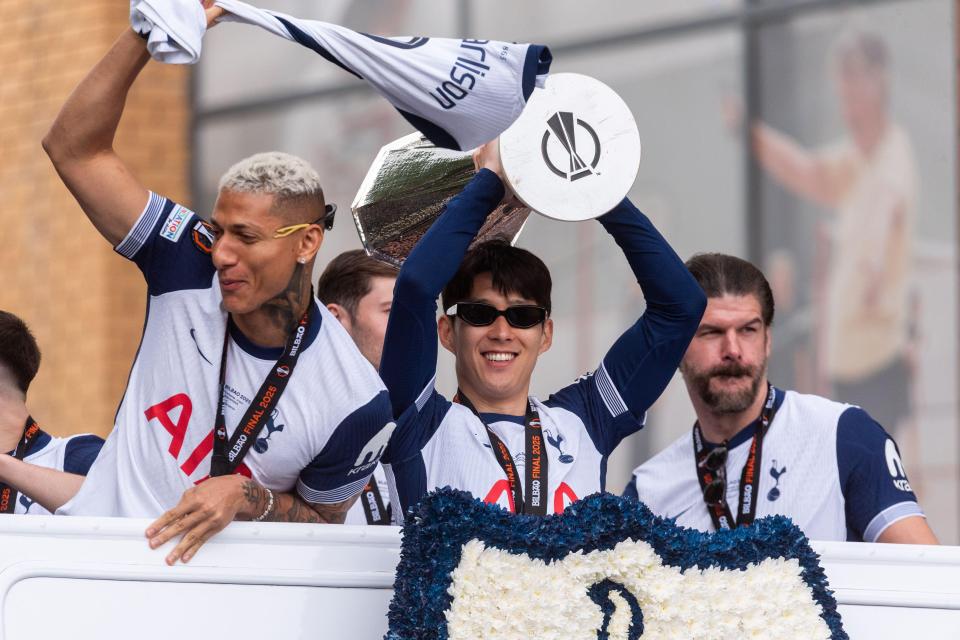Tottenham Hotspur players celebrating their UEFA Europa League victory in a parade.
