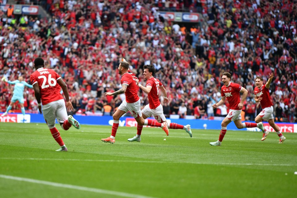 Charlton Athletic players celebrating a goal at Wembley Stadium.