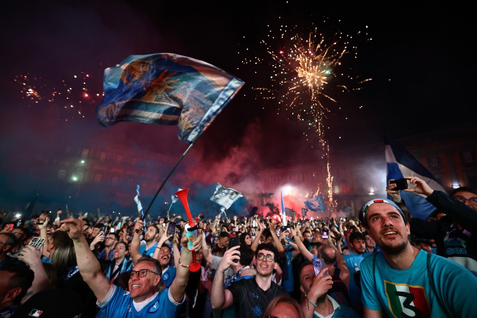 Napoli fans celebrating with fireworks.