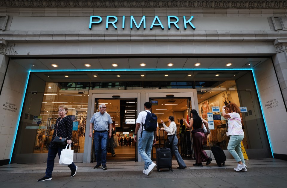 People entering and exiting a Primark store.