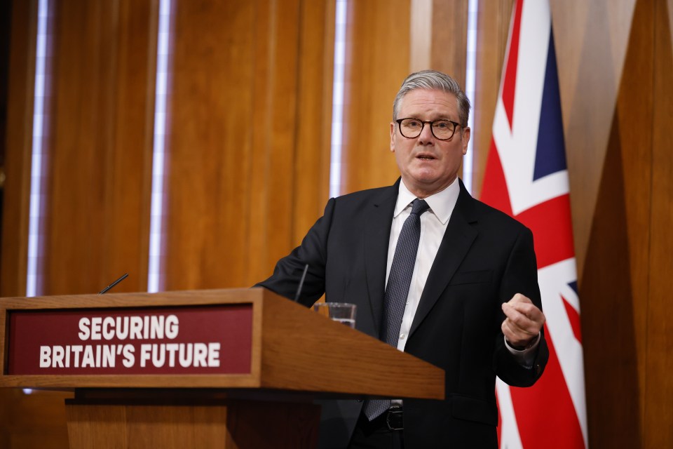 Keir Starmer giving a speech at a podium.