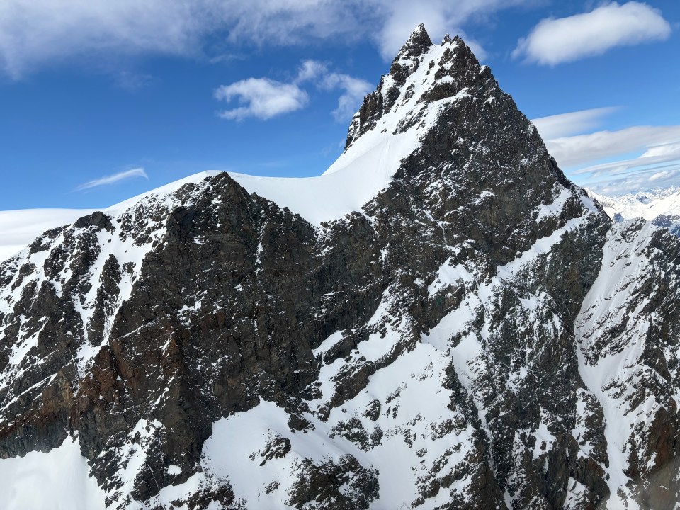 Snow-capped Rimpfischhorn mountain peak in the Swiss Alps.
