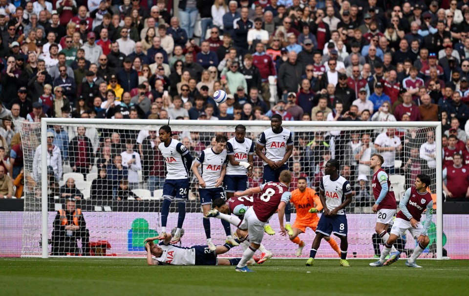 Soccer player taking a free kick.