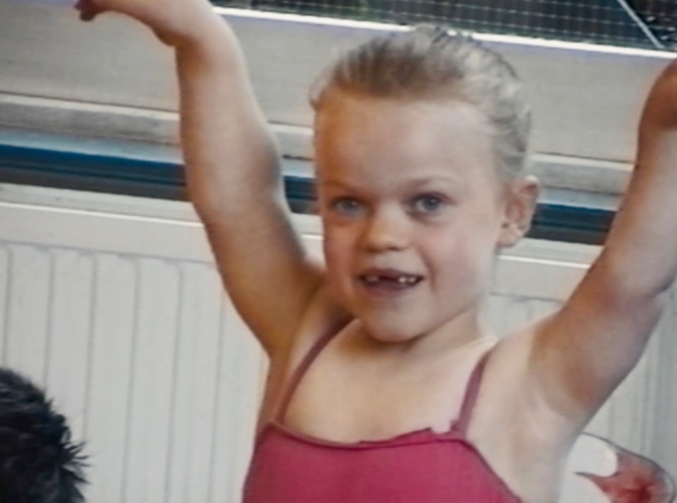 Young Ellie Simmonds in a pink leotard.
