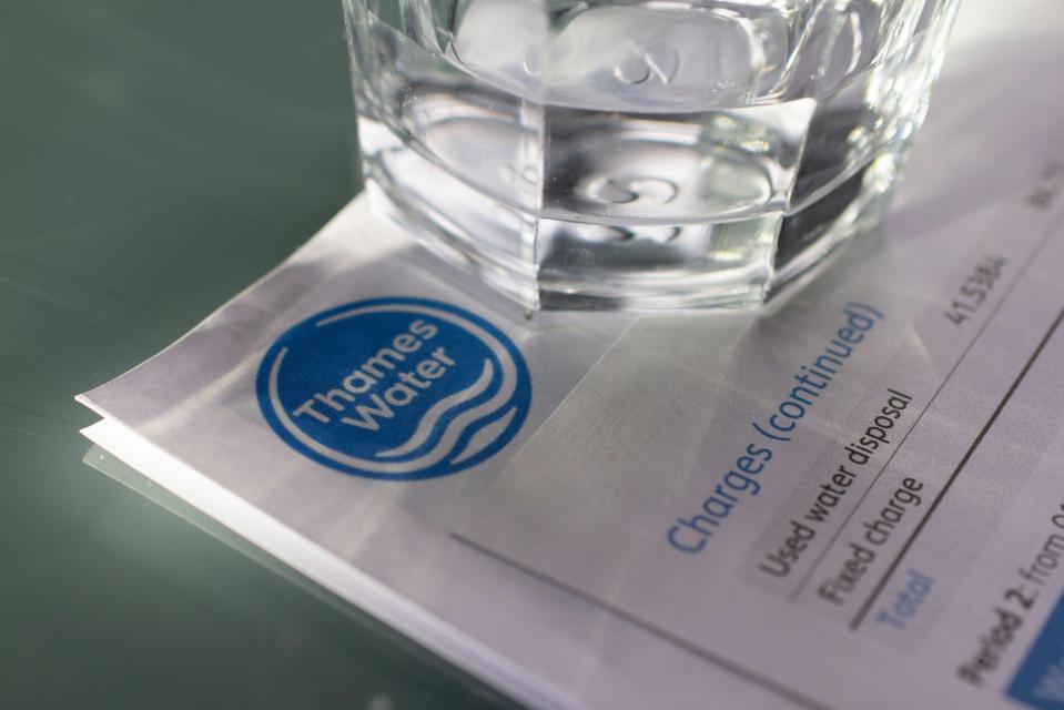 Thames Water bill with glass of water.