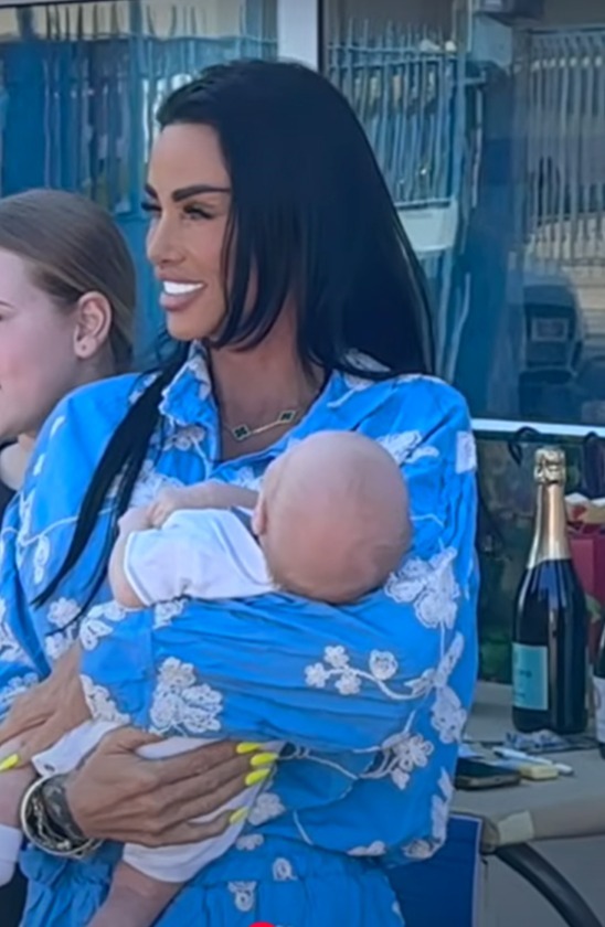 Katie Price at a charity event with family.