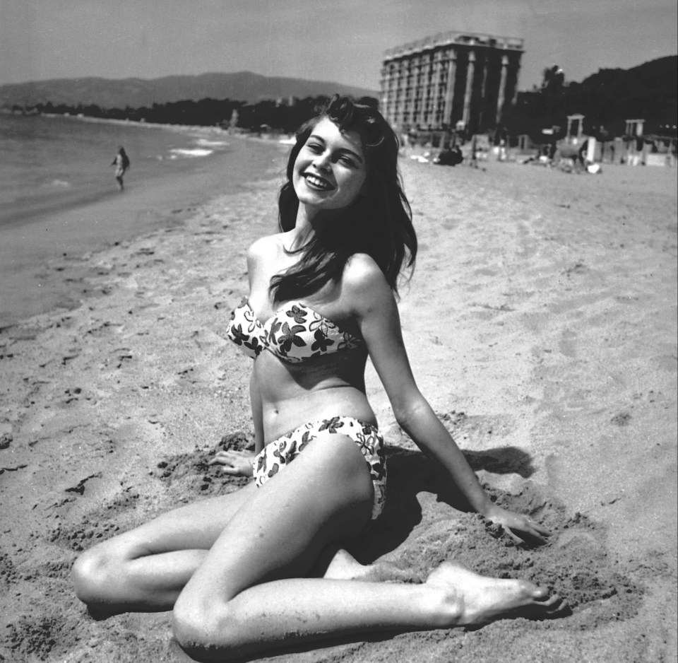 Brigitte Bardot in a bikini on a beach in Cannes, 1953.