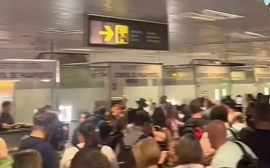 Overcrowded passport control at an airport.