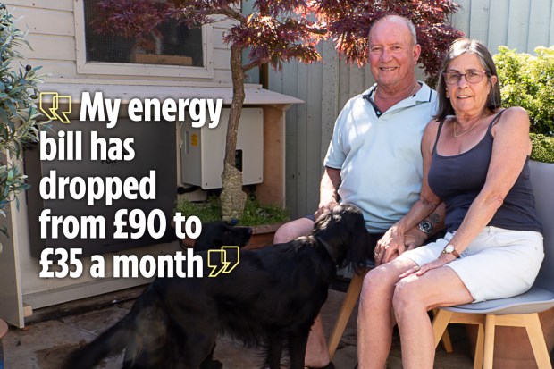 Couple sitting outside with their dog; quote: &quot;My energy bill has dropped from £90 to £35 a month.&quot;