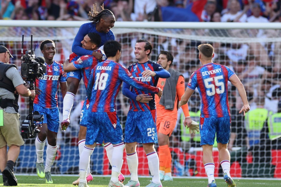Crustal Palace players celebrate after winning the FA Cup final between Manchester City and Crystal Palace at the Wembley Stadium in London, Saturday, May 17, 2025. (AP Photo/Ian Walton)