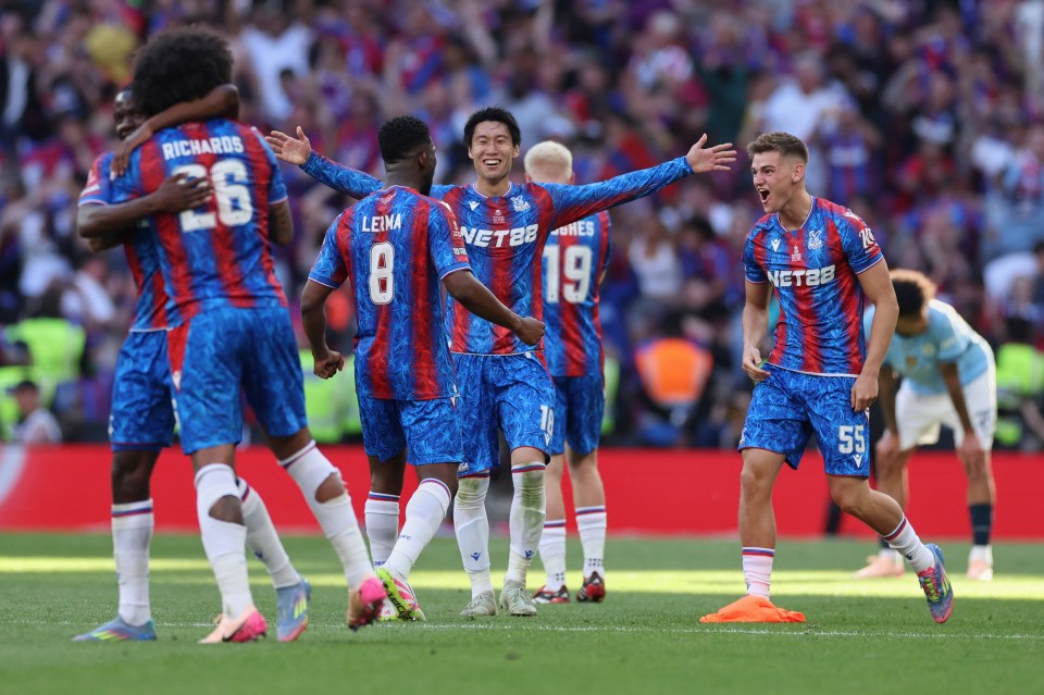 Crustal Palace players celebrate after winning the FA Cup final between Manchester City and Crystal Palace at the Wembley Stadium in London, Saturday, May 17, 2025. (AP Photo/Ian Walton)