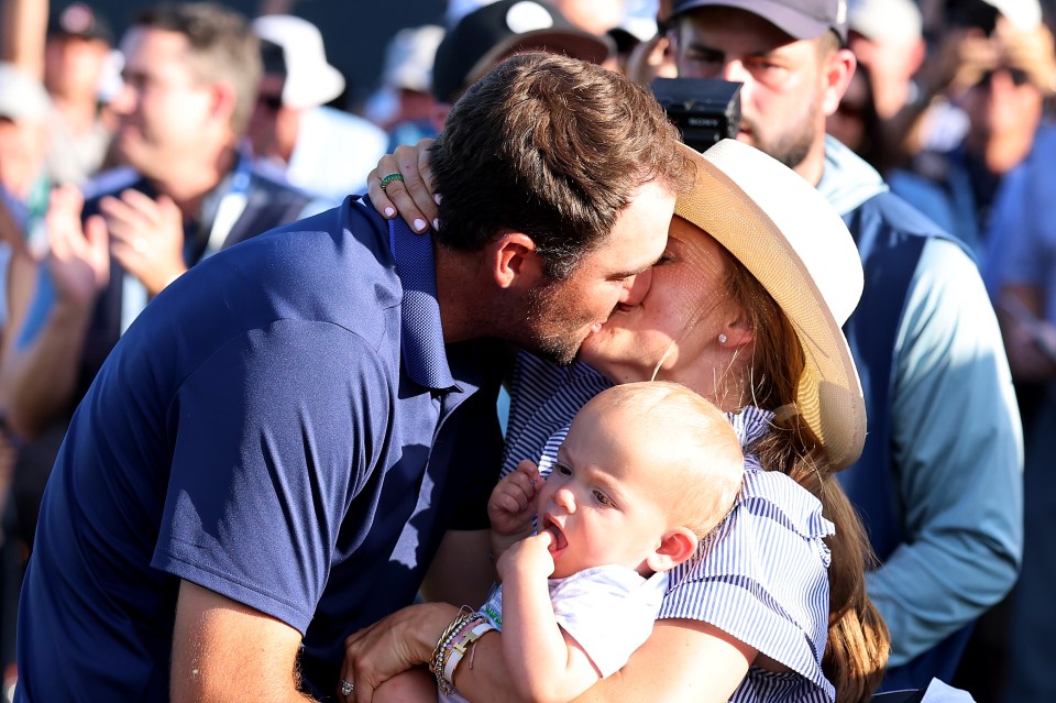 CHARLOTTE, NORTH CAROLINA - MAY 18. Scottie Scheffler of the United States reacts to his victory on the 18th green with wife Meredith & son Bennett during the final round of the PGA Championship at Quail Hollow Country Club on May 18, 2025 in Charlotte, North Carolina. (Photo by David Cannon/Getty Images)