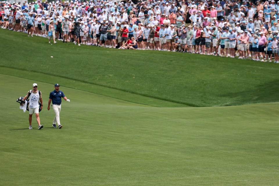 CHARLOTTE, NORTH CAROLINA - MAY 18: Bryson DeChambeau of the United States and his caddie Greg Bodine walk the first fairway during the final round of the PGA Championship at Quail Hollow Country Club on May 18, 2025 in Charlotte, North Carolina. (Photo by Andrew Redington/Getty Images)