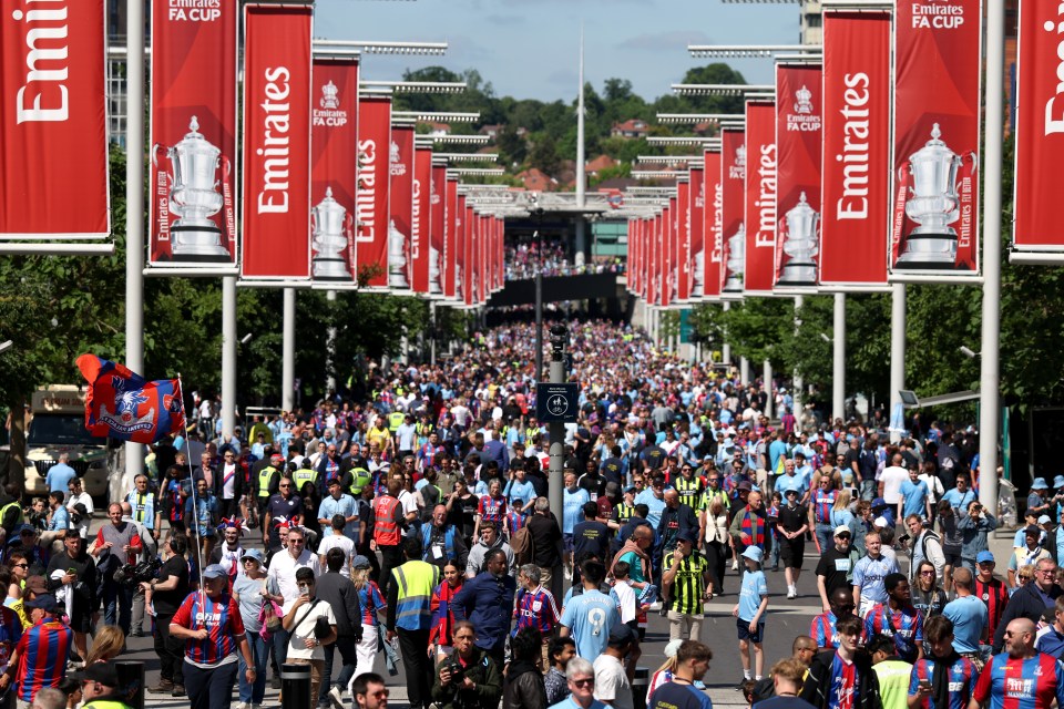 LONDON, ENGLAND - MAY 17: Fans walk down Wembley Way towards the stadium prior to the Emirates FA Cup Final match between Crystal Palace and Manchester City at Wembley Stadium on May 17, 2025 in London, England. (Photo by Julian Finney - The FA/The FA via Getty Images)