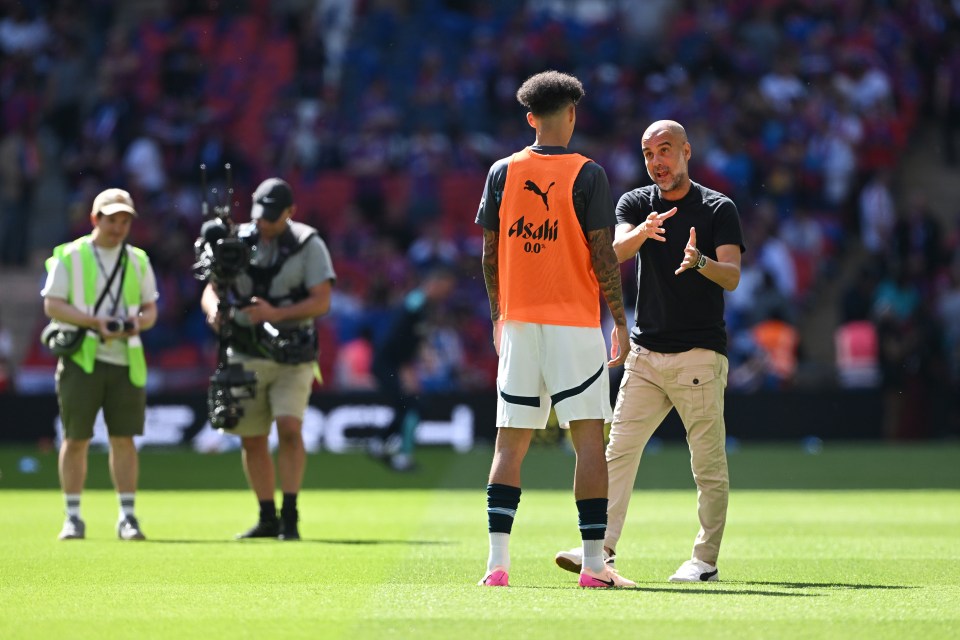 LONDON, ENGLAND - MAY 17: Pep Guardiola, Manager of Manchester City, gives instructions to Nico O'Reilly of Manchester City prior to the Emirates FA Cup Final match between Crystal Palace and Manchester City at Wembley Stadium on May 17, 2025 in London, England. (Photo by Mike Hewitt/Getty Images)