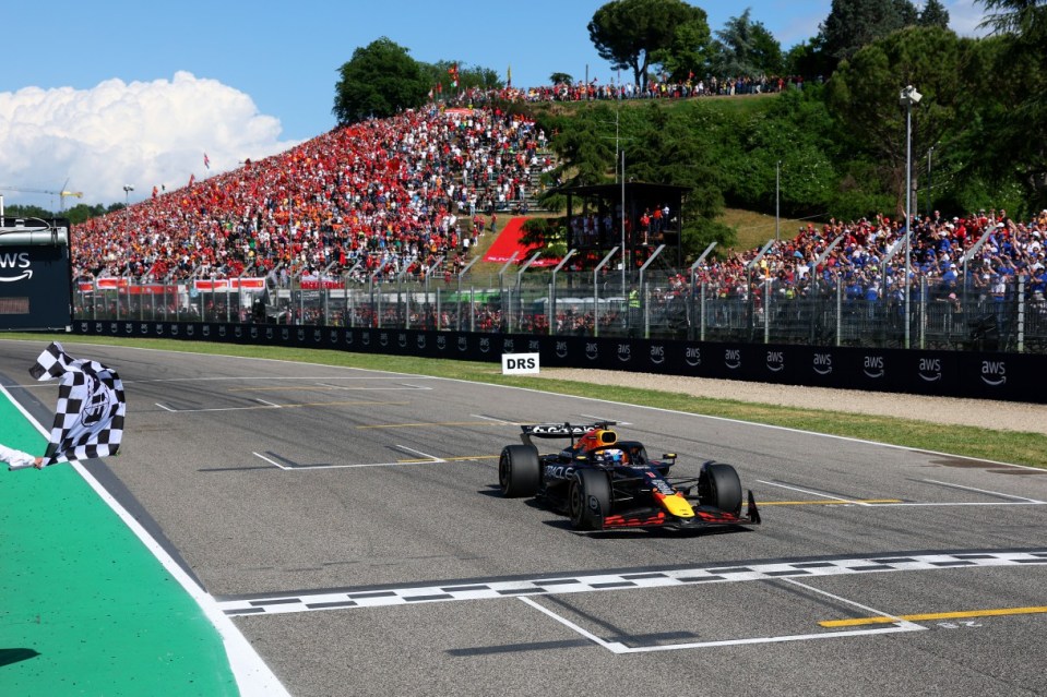 IMOLA, ITALY - MAY 18: Race winner Max Verstappen of the Netherlands driving the (1) Oracle Red Bull Racing RB21 takes the chequered flag during the F1 Grand Prix of Emilia-Romagna at Autodromo Internazionale Enzo e Dino Ferrari on May 18, 2025 in Imola, Italy. (Photo by Clive Rose/Getty Images)
