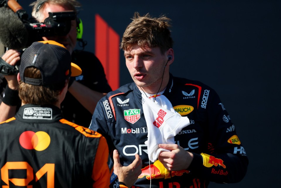 IMOLA, ITALY - MAY 18: Race winner Max Verstappen of the Netherlands and Oracle Red Bull Racing and Third placed Oscar Piastri of Australia and McLaren talk in parc ferme during the F1 Grand Prix of Emilia-Romagna at Autodromo Internazionale Enzo e Dino Ferrari on May 18, 2025 in Imola, Italy. (Photo by Clive Rose/Getty Images)