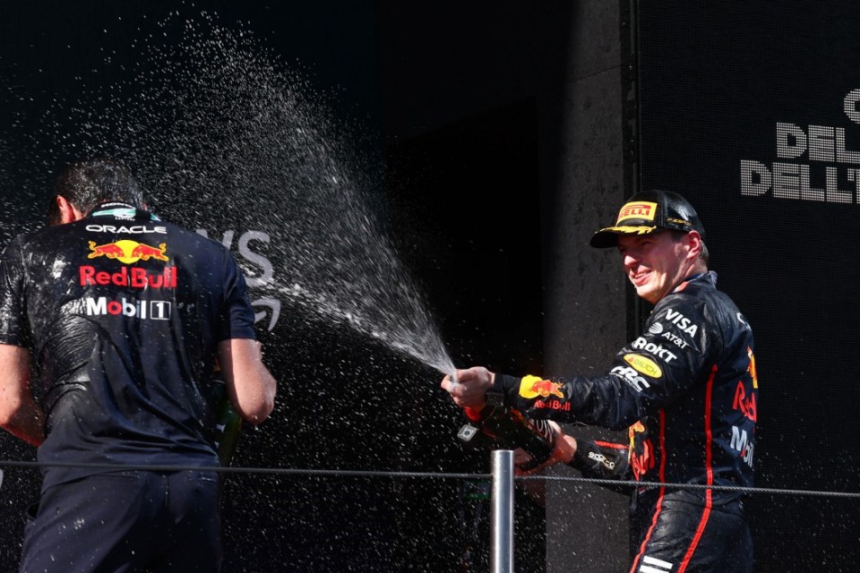 IMOLA, ITALY - MAY 18: Race winner Max Verstappen of the Netherlands and Oracle Red Bull Racing sprays Champagne on the podium during the F1 Grand Prix of Emilia-Romagna at Autodromo Internazionale Enzo e Dino Ferrari on May 18, 2025 in Imola, Italy. (Photo by Clive Rose/Getty Images)