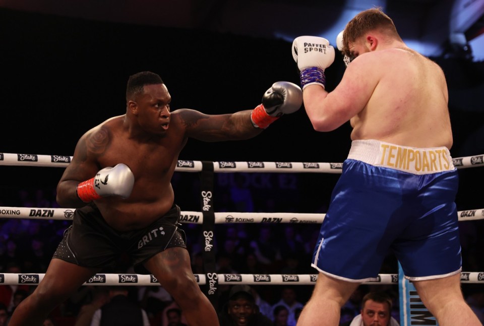TELFORD, ENGLAND - MARCH 04: Godson Umeh punches Tempo Arts during the heavyweight match between Tempo Arts and Godson Umeh at Telford International Centre on March 04, 2023 in Telford, England. (Photo by Nathan Stirk/Getty Images)